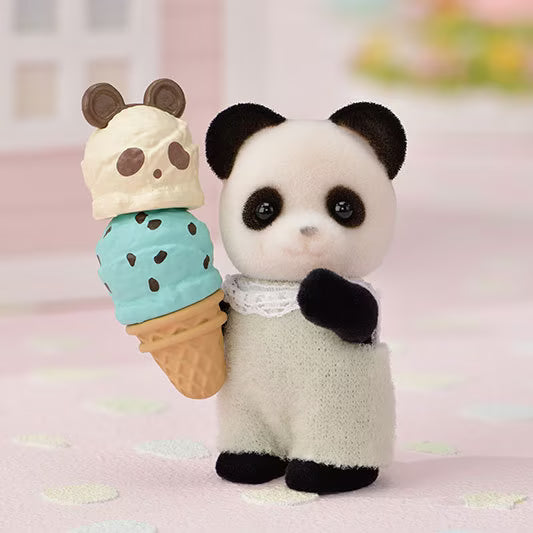 Plush toy panda holding an ice cream cone on a soft pink background