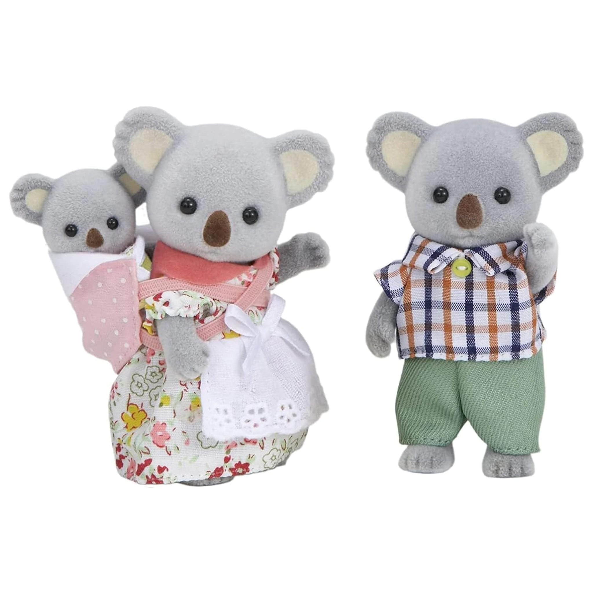 Three toy koalas dressed in colorful outfits on a white background