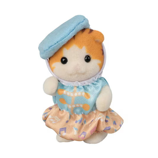 Small plush toy with a blue hat and dress on a white background