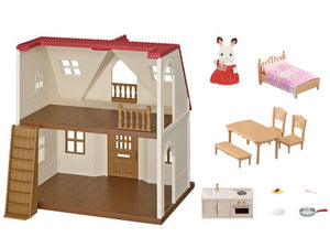 Dollhouse with furniture and accessories on a white background