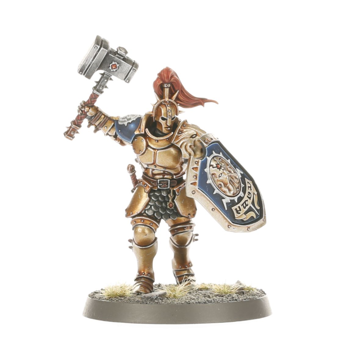 Warhammer Age of Sigmar Introductory Set miniature figure holding a hammer and shield, ready for battle.